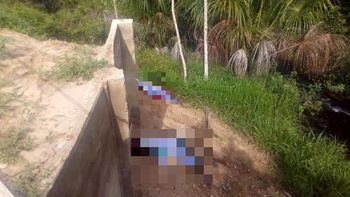 Corpos de adolescente e jovem são encontrados com marcas de tiro na beira de rio